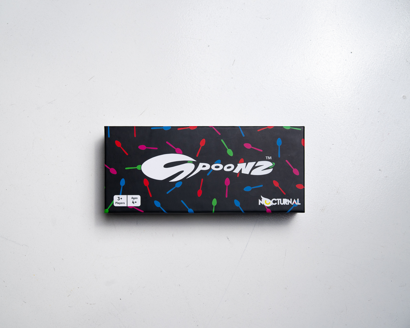 Spoonz box on a wooden table